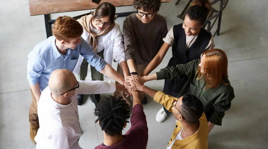 Top view of diverse group of people collaborating in office setting.